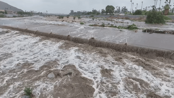 Drone video shows devastating flooding in Palm Springs after Hilary wallops California with torrential rain