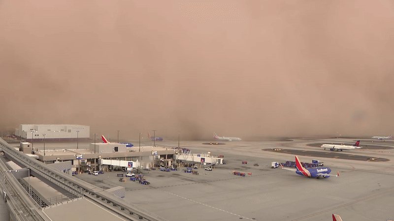 Towering haboob sweeps across Phoenix knocking out power to thousands causing travel chaos in Arizona