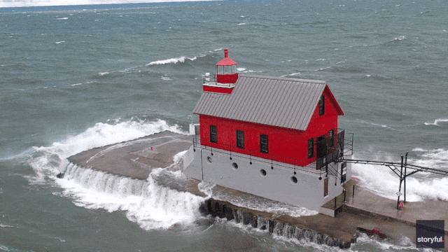 Waves batter Michigan lighthouse as powerful cold front sweeps through