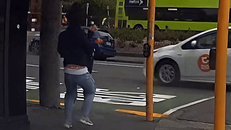 Watch: Woman shoved into oncoming traffic by powerful wind gust in New Zealand