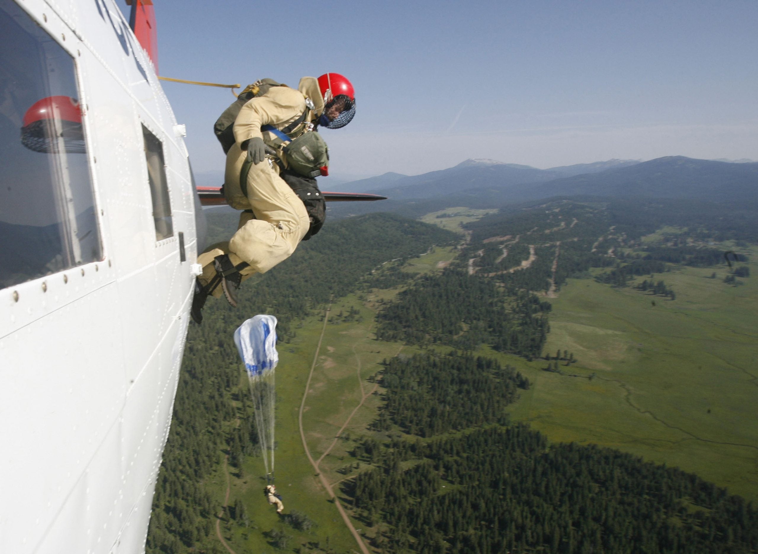 See it: Wildland firefighters leap from 3,000 feet in the air to combat the spread of wildfires