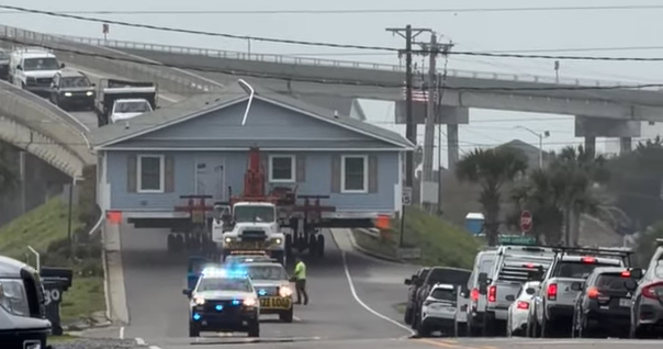 See it: Entire house on small North Carolina highway creates unusual traffic jam