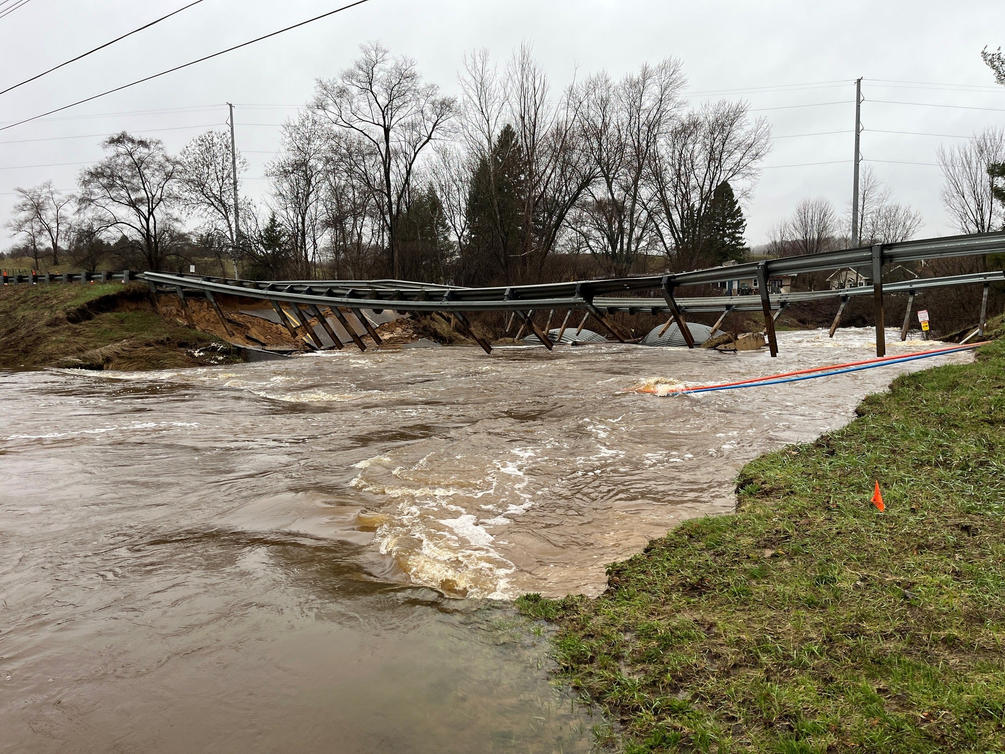 Popular Michigan bridge destroyed as river hits historic flood level