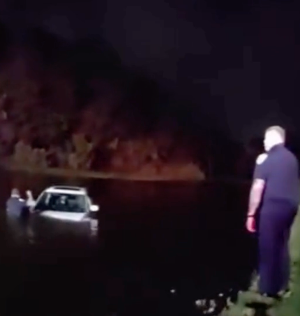Watch: Elderly couple rescued after vehicle slides into pond during heavy downpours in Port St. Lucie