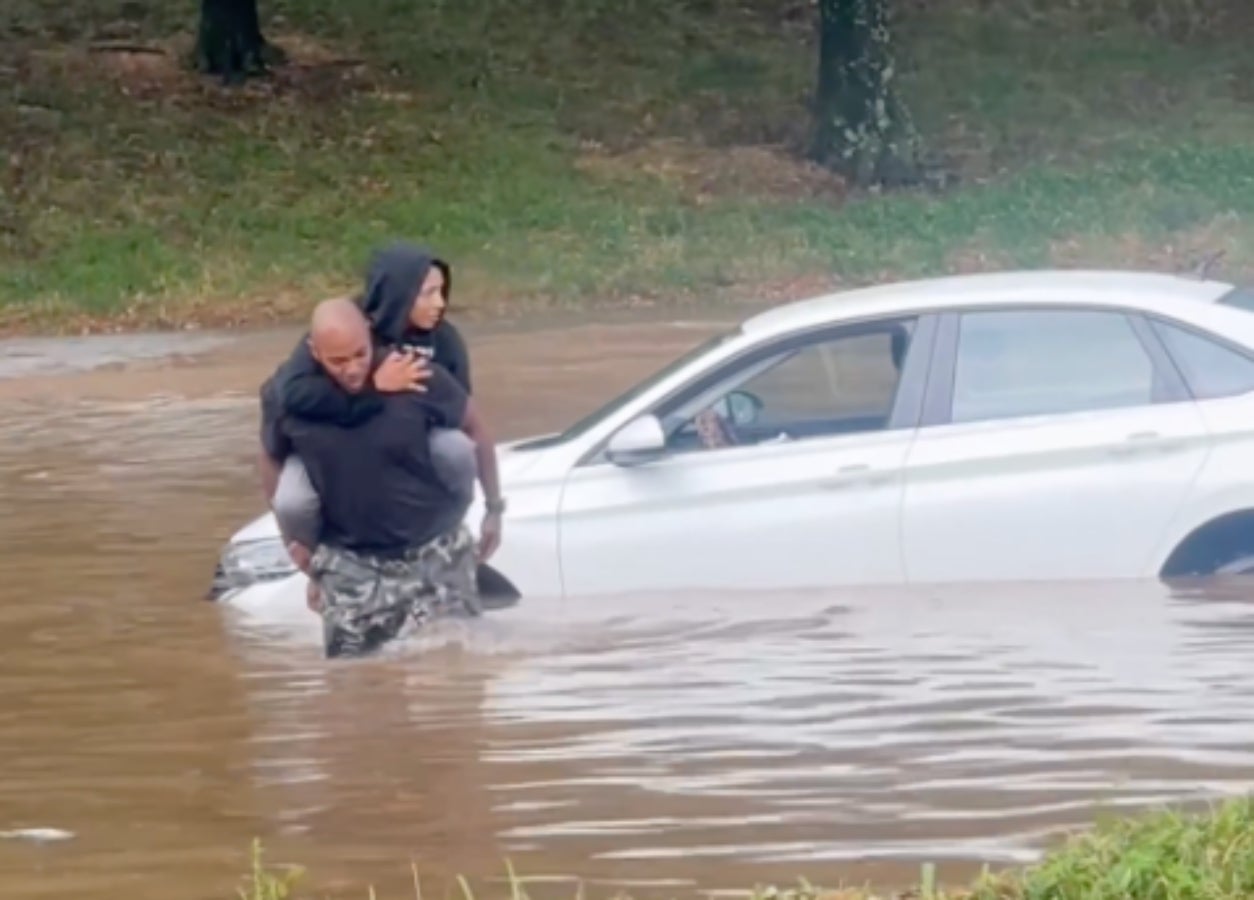 Watch: Good Samaritan carries stranded driver through Atlanta floodwater