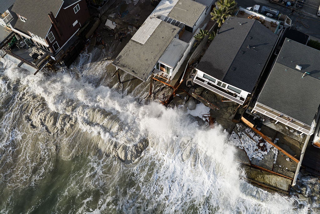 Powerful waves batter Southern California coast, damaging homes and triggering sinkhole